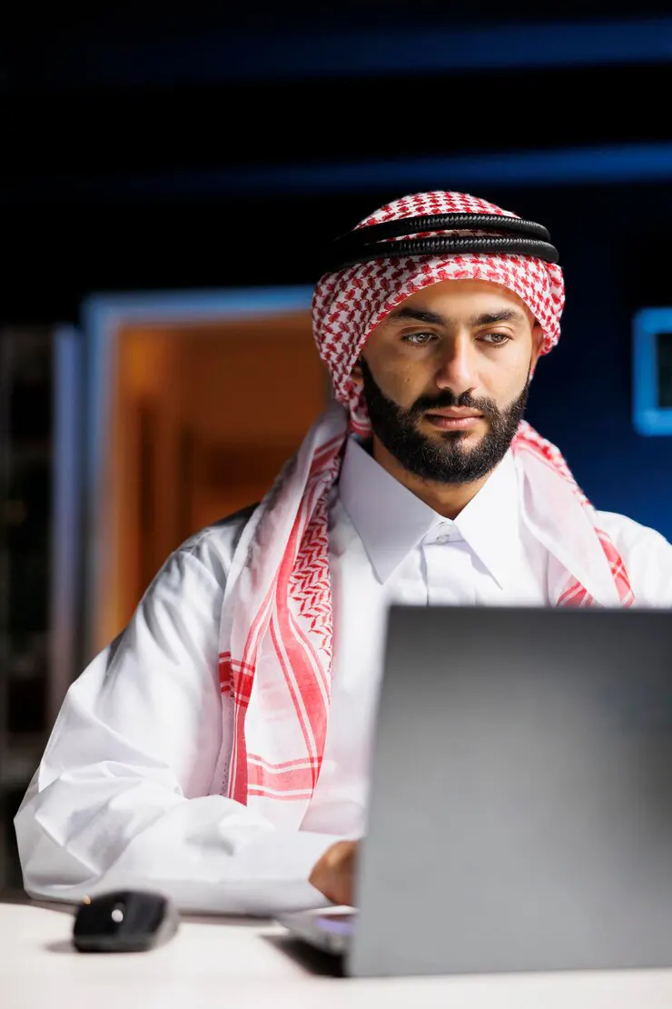 Arabian Man Utilizing His Laptop